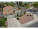 Aerial view of a charming single-Gathering home featuring a well-manicured lawn and spacious driveway at 15902 W Hearn Rd, Surprise, AZ 85379