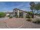 Lovely single-story home boasts a welcoming entrance, two-car garage, and low-maintenance landscaping at 15902 W Hearn Rd, Surprise, AZ 85379