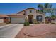 Charming single-story home with a well-maintained front yard and a two-car garage at 15902 W Hearn Rd, Surprise, AZ 85379