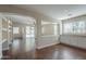 Open-concept living room featuring hard surface floors and seamless flow into the kitchen at 15902 W Hearn Rd, Surprise, AZ 85379