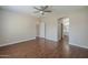 Spacious main bedroom with wood-look floors leading into the ensuite bathroom at 15902 W Hearn Rd, Surprise, AZ 85379