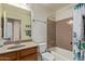 Bathroom featuring a vanity sink, shower-tub combo, and classic fixtures, complemented by functional design at 16280 W Durango St, Goodyear, AZ 85338