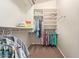 Walk-in closet with built-in shelving and hanging rods, offering ample storage and organization at 16280 W Durango St, Goodyear, AZ 85338