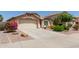 Charming single-Gathering home with a well-manicured lawn and a two-car garage at 16280 W Durango St, Goodyear, AZ 85338