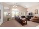 Comfortable living room with vaulted ceilings, large windows, and stylish furnishings at 16280 W Durango St, Goodyear, AZ 85338