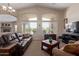 Comfortable living room boasting large windows, plush seating, neutral tones, and a cozy atmosphere at 16280 W Durango St, Goodyear, AZ 85338