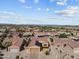 Aerial view of a community with well-maintained homes and desert landscaping at 16444 W Chuparosa Ln, Surprise, AZ 85387
