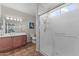 Bathroom featuring single sink vanity and frameless glass shower at 16444 W Chuparosa Ln, Surprise, AZ 85387