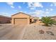 Charming single-story home featuring a well-maintained front yard with desert landscaping and an attached two-car garage at 16444 W Chuparosa Ln, Surprise, AZ 85387