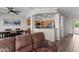 Open-concept living room with breakfast bar and large seating area, perfect for entertaining and Gathering living at 16444 W Chuparosa Ln, Surprise, AZ 85387