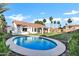 Inviting backyard with a sparkling pool, lush lawn, mature landscaping, and covered patio at 16662 S 37Th Way, Phoenix, AZ 85048