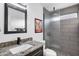 The bathroom features a frosted glass shower stall, decorative mirror, and granite countertop sink at 16662 S 37Th Way, Phoenix, AZ 85048