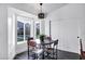 Bright breakfast nook features a modern chandelier and table with seating for four at 16662 S 37Th Way, Phoenix, AZ 85048