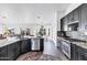 Spacious kitchen with stainless steel appliances, granite countertops, and views into the living spaces at 16662 S 37Th Way, Phoenix, AZ 85048