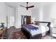 Bright main bedroom with wood-look floors features a sliding barn door to the en-suite bathroom at 16662 S 37Th Way, Phoenix, AZ 85048
