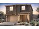 A charming two-story home featuring desert landscaping, a two-car garage and an inviting entryway at 17601 W Luke Ave, Litchfield Park, AZ 85340