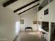 Open living area with vaulted ceilings, beams, and lots of natural light at 1831 W Mulberry Dr # 241, Phoenix, AZ 85015