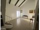 Open living room featuring high ceilings, exposed beams, and lots of natural light at 1831 W Mulberry Dr # 241, Phoenix, AZ 85015
