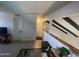 Bright living space featuring tile floors, staircase, and an upper-level loft at 1831 W Mulberry Dr # 241, Phoenix, AZ 85015