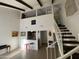 Bright open floorplan with high ceilings and exposed beams, connecting living areas and stairs at 1831 W Mulberry Dr # 241, Phoenix, AZ 85015