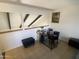 Bright office space featuring a modern desk setup, unique architectural elements, and neutral tile flooring at 1831 W Mulberry Dr # 241, Phoenix, AZ 85015