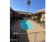 Resort-style community pool surrounded by lush landscaping and private balconies at 1831 W Mulberry Dr # 241, Phoenix, AZ 85015