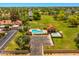 Aerial view of the community pool, green lawns, and surrounding neighborhood at 1910 E Citation Ln, Tempe, AZ 85284