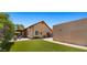 Beautiful backyard featuring artificial grass, hot tub and covered patio at 1910 E Citation Ln, Tempe, AZ 85284