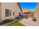 Private backyard with hot tub, artificial grass area, and well-maintained landscaping at 1910 E Citation Ln, Tempe, AZ 85284