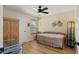Comfortable bedroom featuring a daybed, ceiling fan, and wood floors at 1910 E Citation Ln, Tempe, AZ 85284