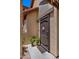 Welcoming front entrance with a decorative metal door, potted flowers, and a charming welcome sign at 1910 E Citation Ln, Tempe, AZ 85284