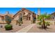 Charming single-story home with desert landscaping, a tiled roof, and a welcoming walkway to the front door at 1910 E Citation Ln, Tempe, AZ 85284