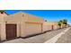 Multiple car garages in a community setting with individual access gates for privacy and convenience at 1910 E Citation Ln, Tempe, AZ 85284