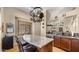 This kitchen features an island with seating, stainless steel appliances, and a hanging pot rack for extra storage at 1910 E Citation Ln, Tempe, AZ 85284