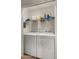 Efficient laundry room with a side-by-side washer and dryer at 1910 E Citation Ln, Tempe, AZ 85284