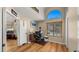 Home office with large arched window, wood floors, and a dedicated workspace for productivity at 1910 E Citation Ln, Tempe, AZ 85284