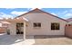 The covered patio provides shade and outdoor living space in the low maintenance backyard at 19523 N Carriage Ln, Surprise, AZ 85374