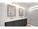 Double vanity with modern fixtures, offering a blend of functionality and contemporary design in the bathroom at 19523 N Carriage Ln, Surprise, AZ 85374