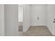 Entryway with tile floors, white walls, and white doors at 19523 N Carriage Ln, Surprise, AZ 85374