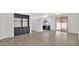 Bright living room featuring modern built-in shelving and sliding glass doors at 19523 N Carriage Ln, Surprise, AZ 85374