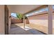 Covered patio with an open backyard space, perfect for outdoor entertaining or relaxation at 19523 N Carriage Ln, Surprise, AZ 85374