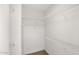 Walk-in closet provides ample storage space with built-in shelving, ideal for organizing your wardrobe at 19523 N Carriage Ln, Surprise, AZ 85374