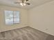 Neutral bedroom with a window letting in natural light and a ceiling fan at 2100 W Lemon Tree Pl # 59, Chandler, AZ 85224