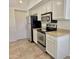 Well-equipped kitchen featuring stainless steel appliances, granite countertops, and ample cabinet space at 2100 W Lemon Tree Pl # 59, Chandler, AZ 85224