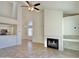 Bright and airy living room with a fireplace, vaulted ceiling, and an open layout to the kitchen at 2100 W Lemon Tree Pl # 59, Chandler, AZ 85224