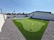 Backyard featuring a putting green, a bright blue swimming pool, and desert landscaping at 2111 N Van Ness Ave, Tempe, AZ 85288