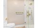 Bathroom featuring modern shower, gold fixtures, and neutral paint at 2111 N Van Ness Ave, Tempe, AZ 85288