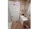 Bathroom with tile floors, modern vanity, gold fixtures, and designer mirror at 2111 N Van Ness Ave, Tempe, AZ 85288