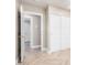 Bedroom featuring herringbone floors, closet with sliding doors, and natural light at 2111 N Van Ness Ave, Tempe, AZ 85288