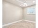 Bright bedroom featuring modern ceiling fan, neutral paint, herringbone flooring, and natural light at 2111 N Van Ness Ave, Tempe, AZ 85288